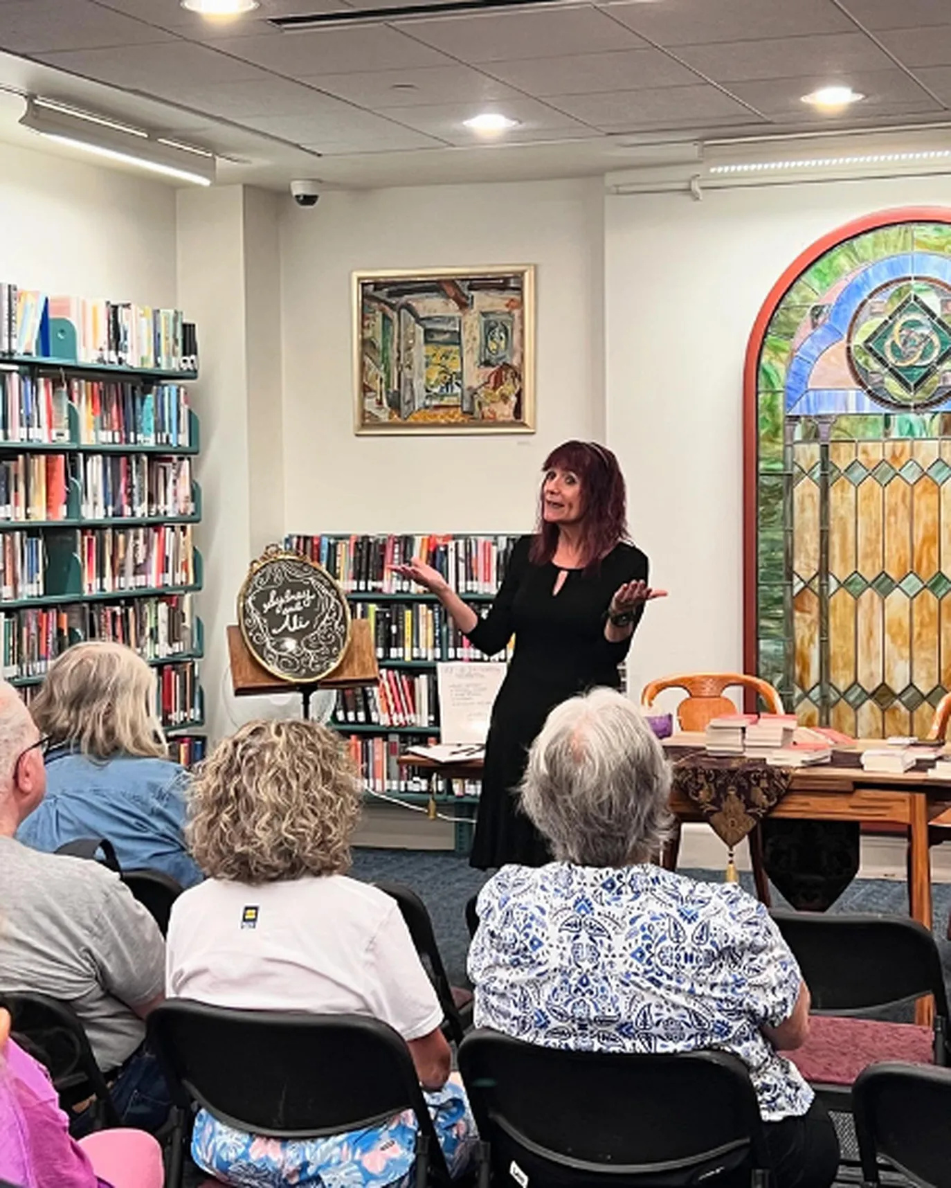 Jeannette de Beauvoir speaking to a library audience.